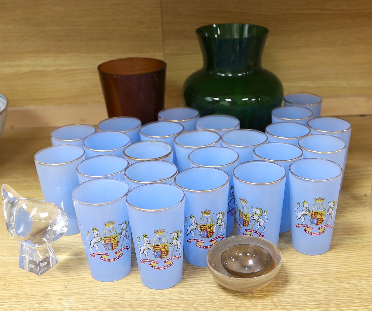 An assortment of twenty-four Coronation glasses in celebration of Queen Elizabeth II, together with other glassware and items to include a Baccarat model of a bird